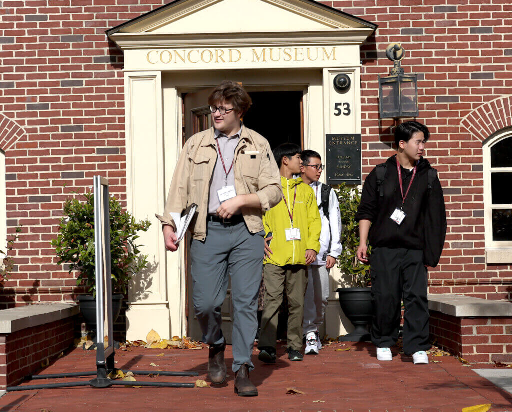Jack McCarthy, right, the coordinator of international relations for the town of Nanae, Japan, leads his student delegration after a visit to the Acton Museum on Tuesday, October 28, 2025. Ken McGagh/The Acton Bridge