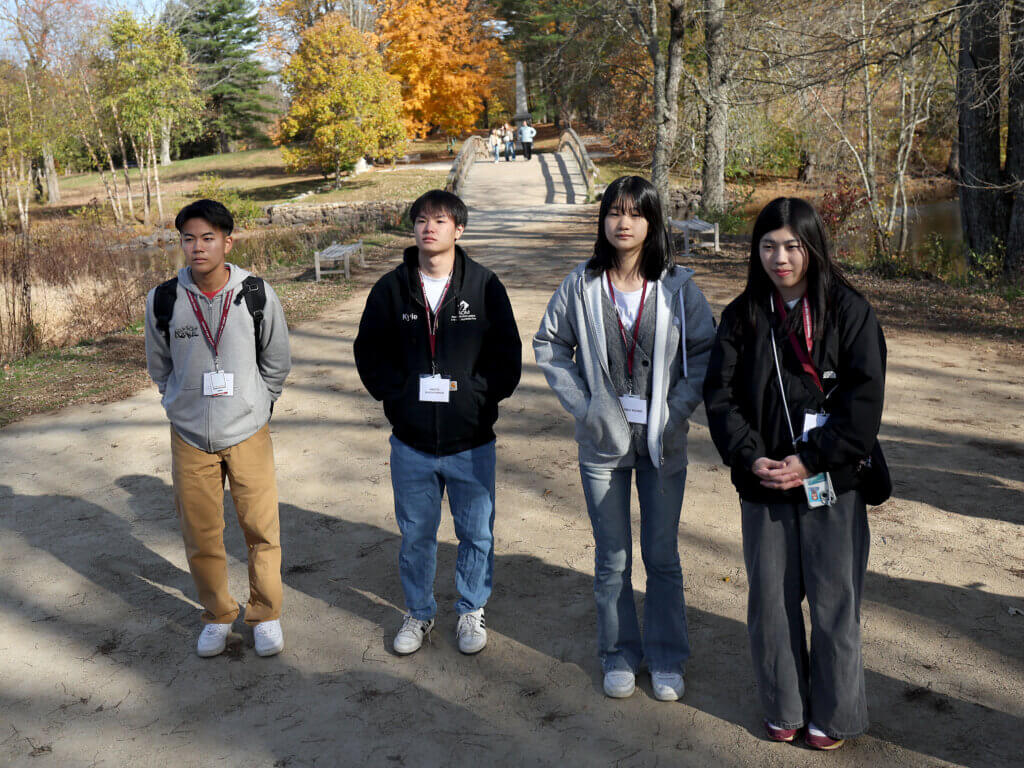 Nanae students (from leftt) Soa Waki, Hinata Nihonyanagi, Ryoka Koishi and Kiyoka Ogawa listen to tour guide Joe Palumbo during a visit to North Bridge on Tuesday, October 28, 2025. Ken McGagh/The Acton Bridge