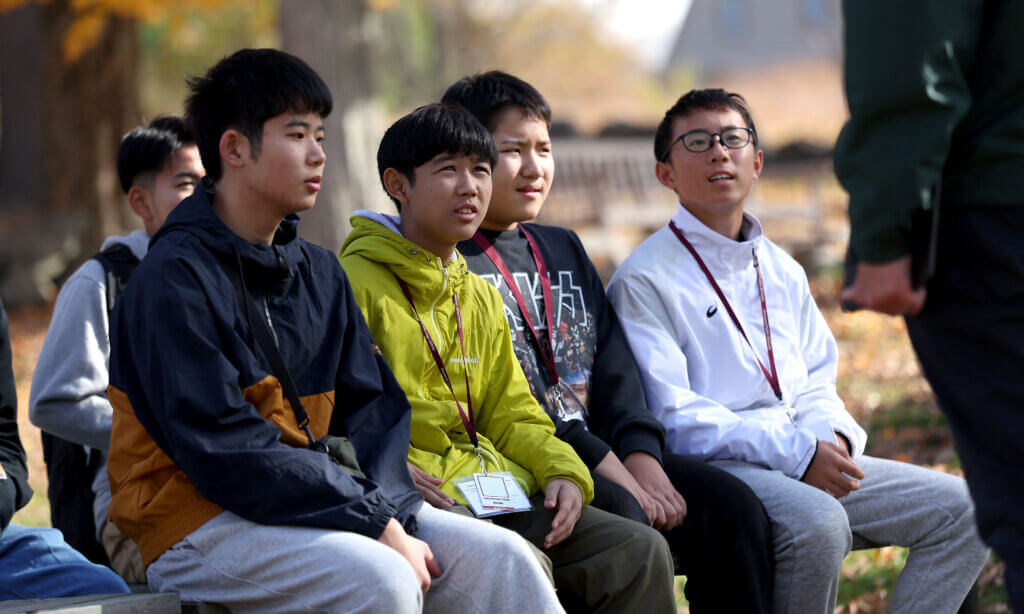 Nanae students (from left) Daaiki Iriyama, Outa Kitamura, Shogo Kimura and Joshin Kugita listen to tour guide Joe Palumbo at Nortrh Bridge on Tuesday, October 28, 2025. Ken McGagh/The Acton Bridge