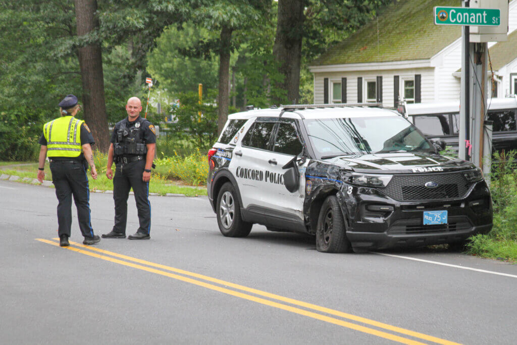 A damaged police cruiser ended up on the side of Laws Brook Road after hitting an LRTA bus. Photo: Dakota Antelman/The Acton Bridge