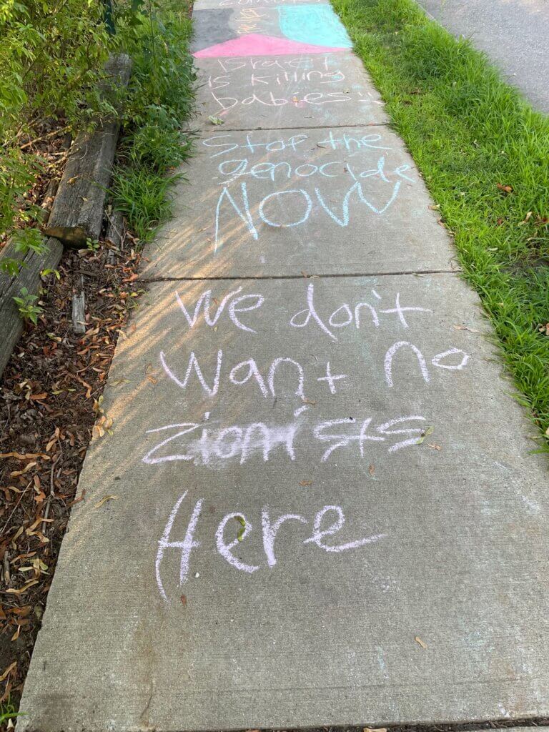 Police are also investigating chalk messages scrawled next to the property. Image courtesy of Kurt Schwartz