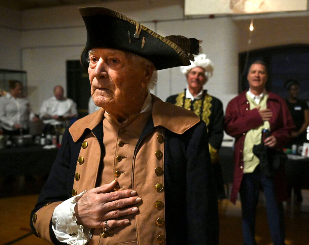 Philip B. Dee Jr. of Acton stands for the National Anthem during the 2025 Patriots Ball’ at the Acton Armory on Saturday, April 12, 2025. Ken McGagh/The Acton Bridge