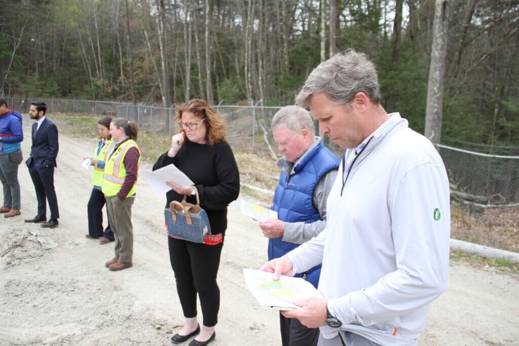 Omni Properties partner and Acton Business Partnership President Tyler Spring, right, examines a map of the Main Street property. Photo: Dakota Antelman/The Acton Bridge
