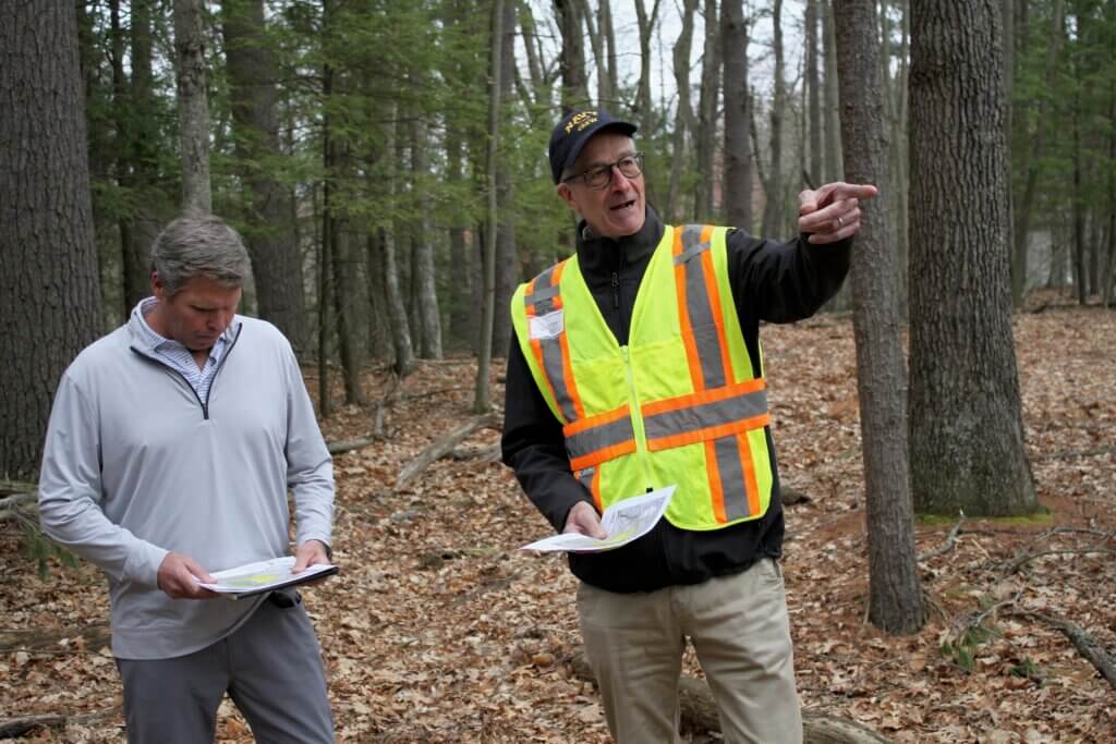 Cleanup project coordinator Bruce Thompson, right, points to a pile of soil during a tour of the 2229 Main Street Superfund site. Photo: Dakota Antelman/The Acton Bridge