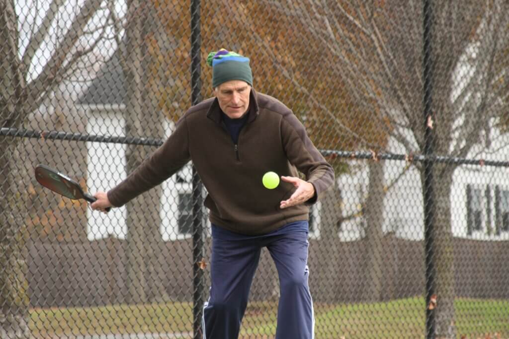 Randy Brown begins a serve. Photo: Dakota Antelman/The Acton Bridge