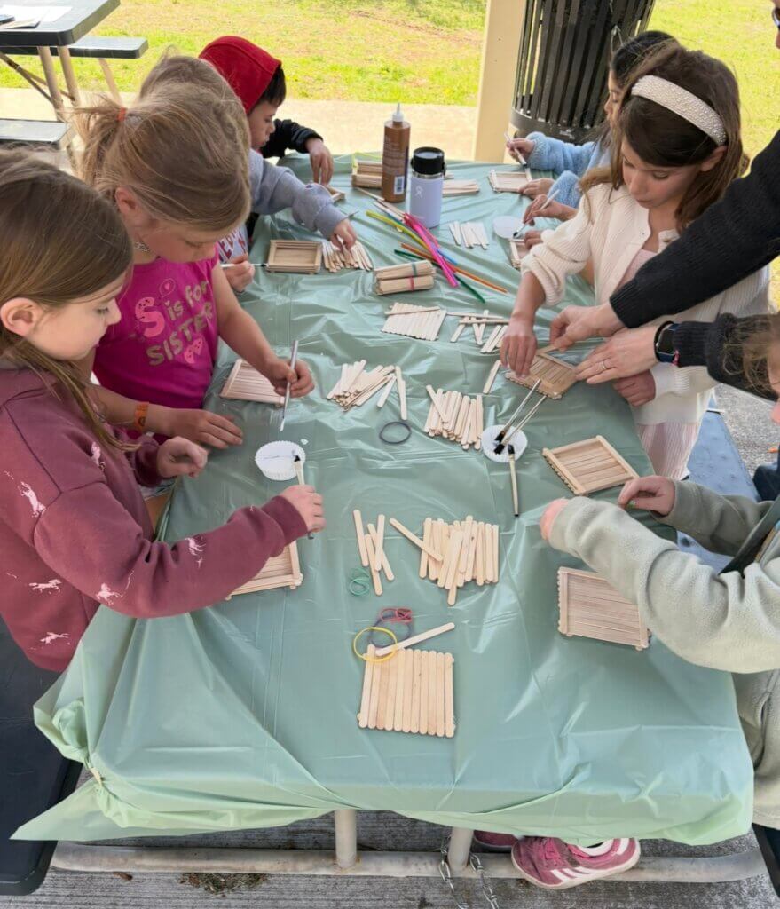 Students build bird feeders outside. Courtesy photo