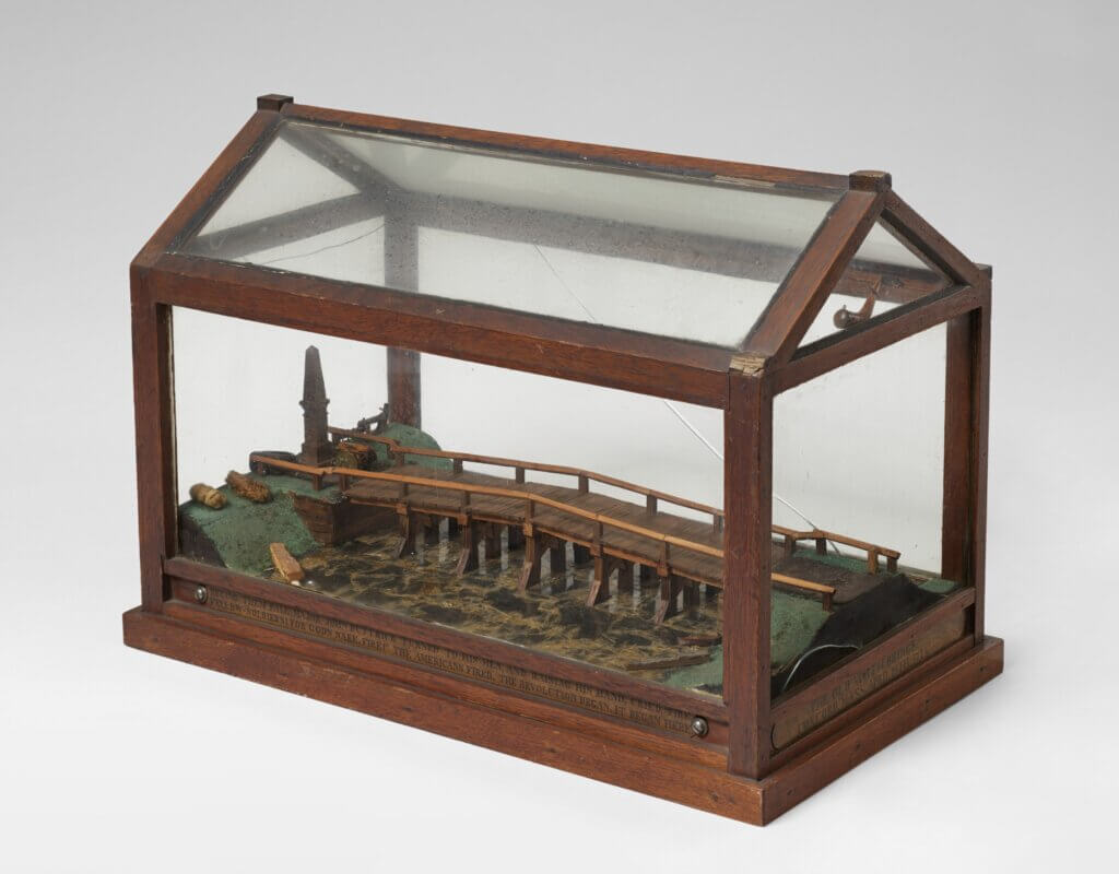 A model (circa 1920) of the North Bridge made by Edwin A. Buttrick of Acton using nearly 20 wooden relics from historical sites, including Mount Vernon and the frigates USS Constitution and USS Merrimac. Photo courtesy of the Acton Museum
