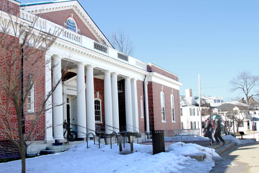 Two visitors enter the Acton Free Public Library during Sunday hours on March 2. Photo: Dakota Antelman/The Acton Bridge