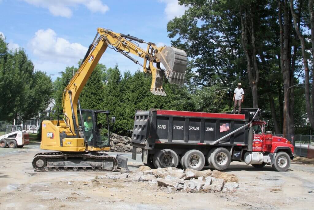 Heavy machinery loads demolition debris into a dump truck on August 26. Photo: Dakota Antelman/The Acton Bridge