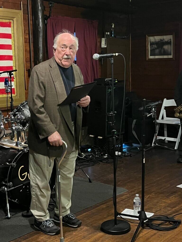 Henry Dane, a former club president, reads a proclamation in honor of the club’s centennial. Photo courtesy of the Acton Rod & Gun Club