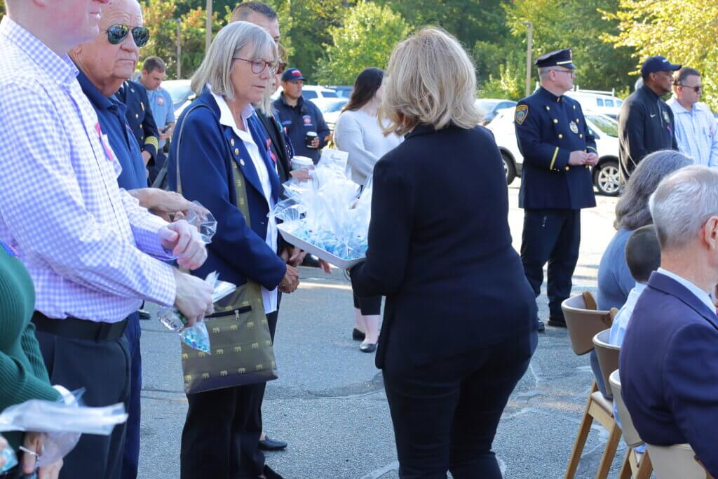 The Rotary Club handed out bags of blue glass beads, referencing art at the 9/11 Memorial & Museum titled “Trying to Remember the Color of the Sky on That September Morning” by Spencer Finch. Photo: Trace Salzbrenner/The Acton Bridge