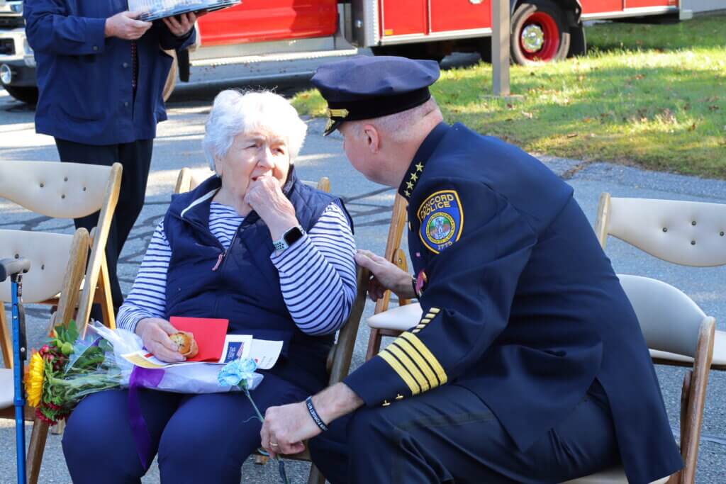 Police Chief Tom Mulcahy speaks with Al Filipov’s widow, Loretta Filipov, after the event. Photo: Trace Salzbrenner/The Acton Bridge