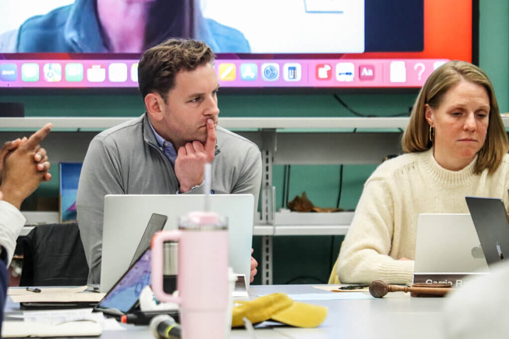 Acton School Committee Chair Andrew Herchek listens while schools Superintendent Laurie Hunter gives an update. Photo: Trace Salzbrenner/The Acton Bridge