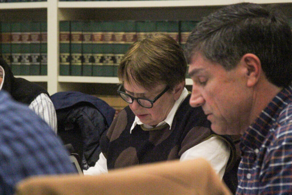 Select Board members Cameron McKennitt and Mary Hartman take notes during a February 25 Select Board meeting. Photo: Dakota Antelman/The Acton Bridge