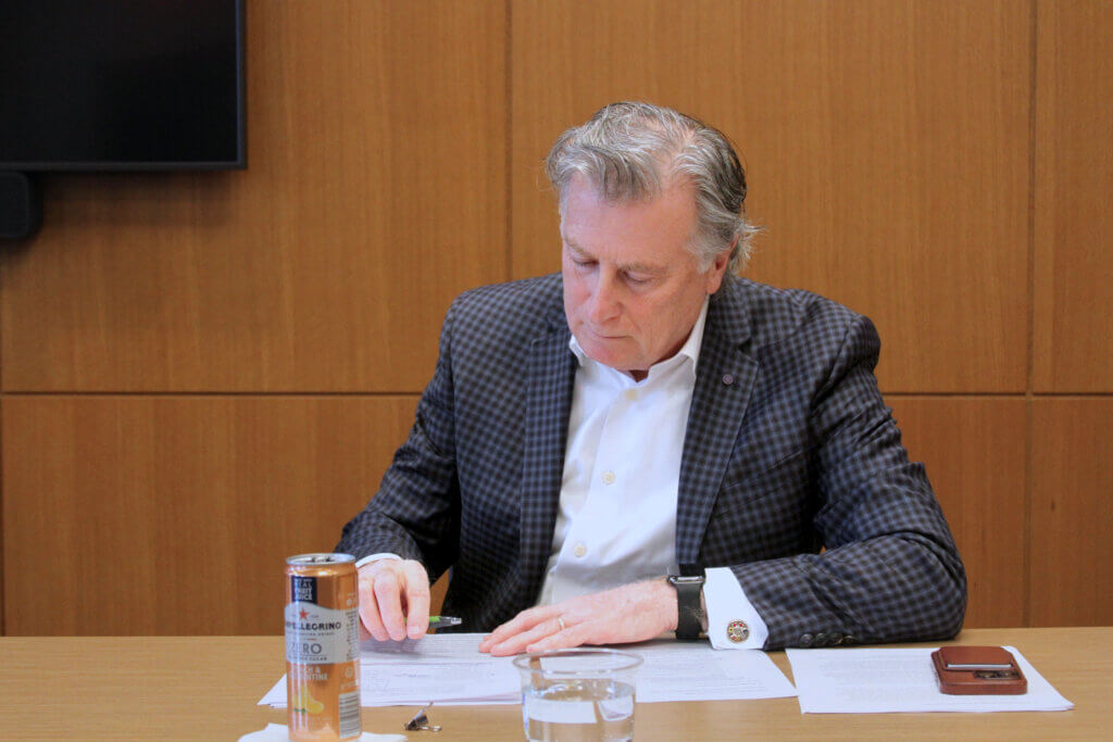 Joe Laurin takes notes during a March 5 candidate forum at The Acton Free Public Library. Photo: Dakota Antelman/The Acton Bridge