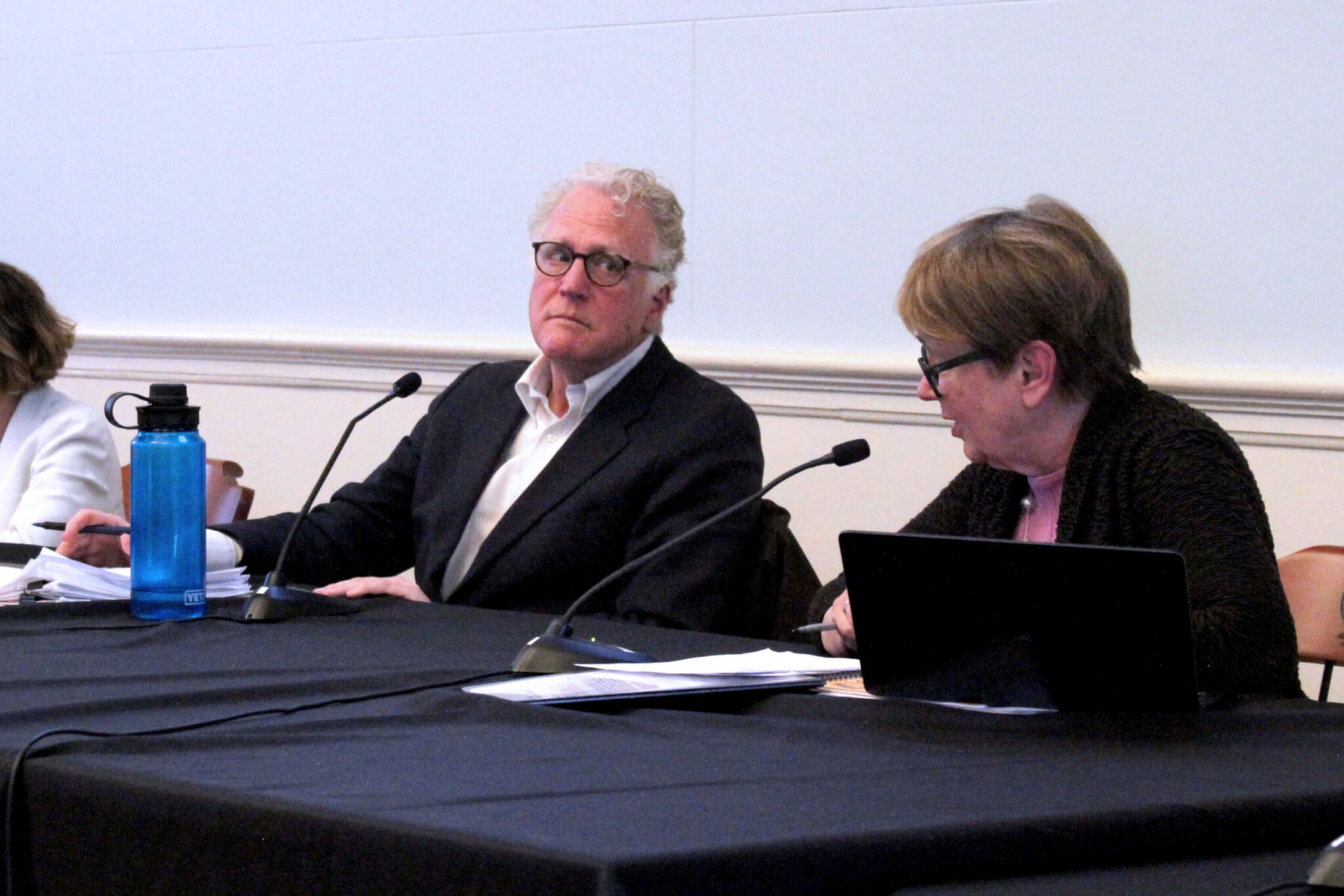 Municipal Affordable Housing Trust Chair Keith Bergman listens to Select Board Chair Mary Hartman during a May 19 meeting of local housing leaders. Photo: Dakota Antelman/The Acton Bridge