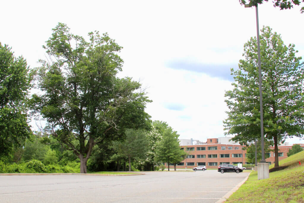 Plans for new housing on Baker Avenue would site buildings over part of an existing parking lot. Photo: Dakota Antelman/The Acton Bridge
