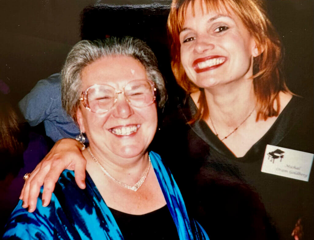 “Mrs. Di” and former music student Michelle Oram at the reunion concert 30 years ago. Courtesy photo