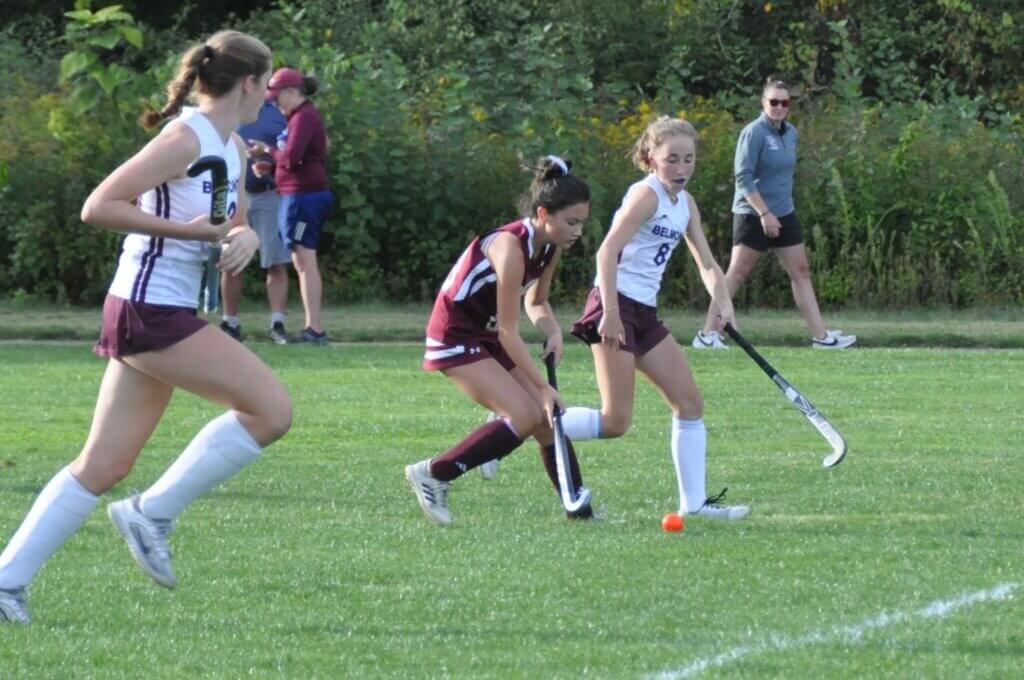 Eighth grader Evie Clancy stickhandling against Belmont. Photo by David Clancy