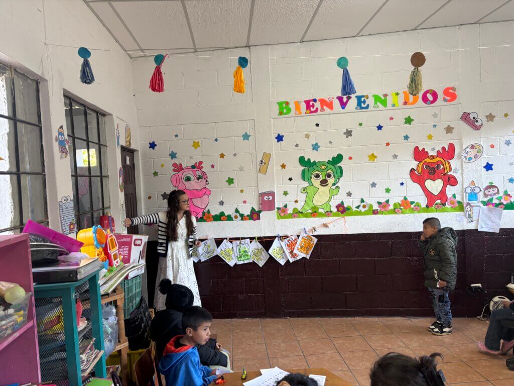 Dr. Susan Folgar O’Shea evaluates a student with a visual acuity chart. Courtesy photo