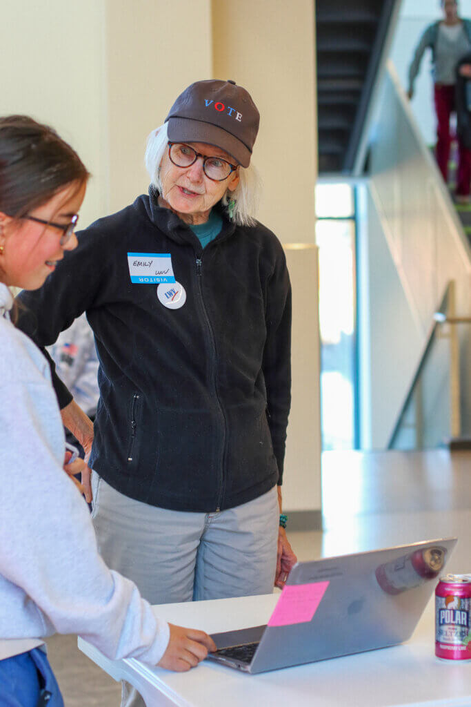 Emily Wheeler listens as a student discusses their project. Photo: Trace Salzbrenner/The Acton Bridge