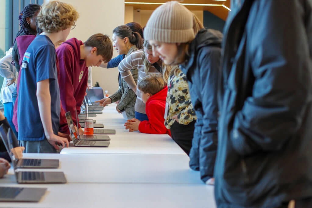 Students filled both the library and “the bridge” section next to the entrance to present on their laptops. Photo: Trace Salzbrenner/The Acton Bridge