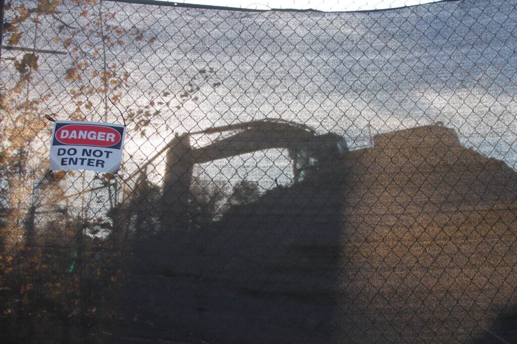 A black screen blocks the entrance to the site of a proposed pocket park within a larger 20-lot subdivision off Main and Highland Streets. Photo: Dakota Antelman/The Acton Bridge