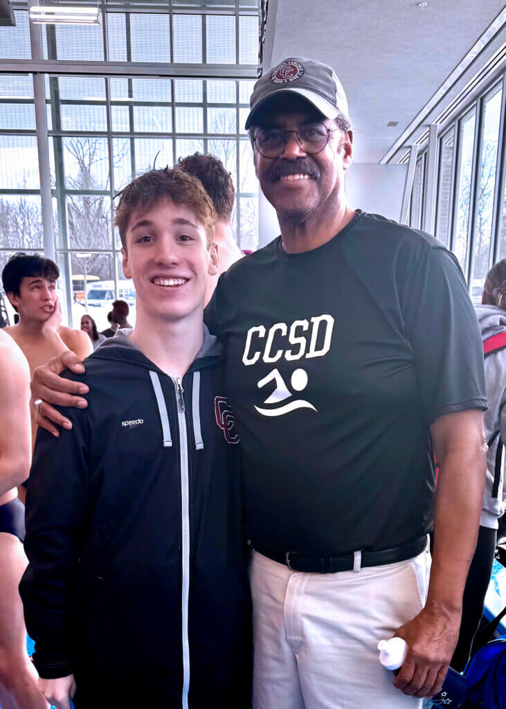 Senior diver Thomas Stone with coach Jerry Moss. Photo by Casey Carlson