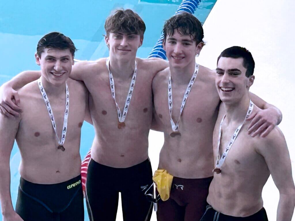 The 400-yard freestyle relay team: Cole Scafidi, Brandon Monaghan, Andrew Hodges, and Presley Rodgers. Photo by Sarah Rodgers