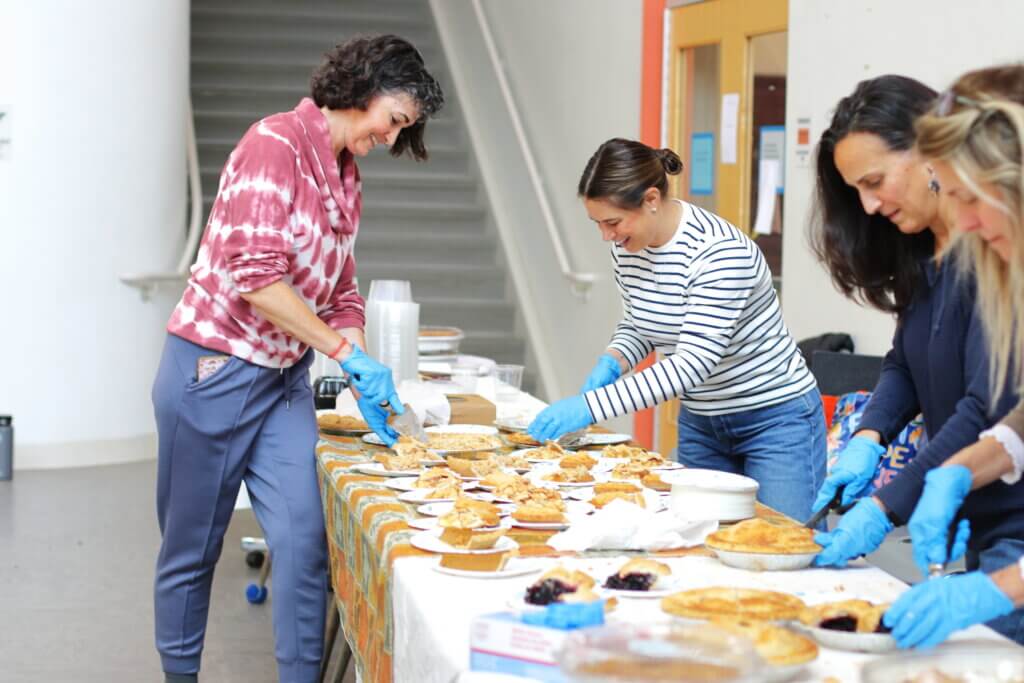 Amanda Calabro, Shauna Tibbitt, Anne Everly, and Laurie Fortunato dish up dessert. Photo: Trace Salzbrenner/ The Acton Bridge