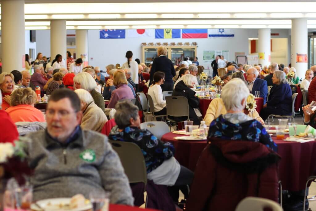 The CCHS cafeteria was filled with residents and students enjoying Thanksgiving staples like turkey, mashed potatoes, stuffing, and rolls. Photo: Trace Salzbrenner/ The Acton Bridge