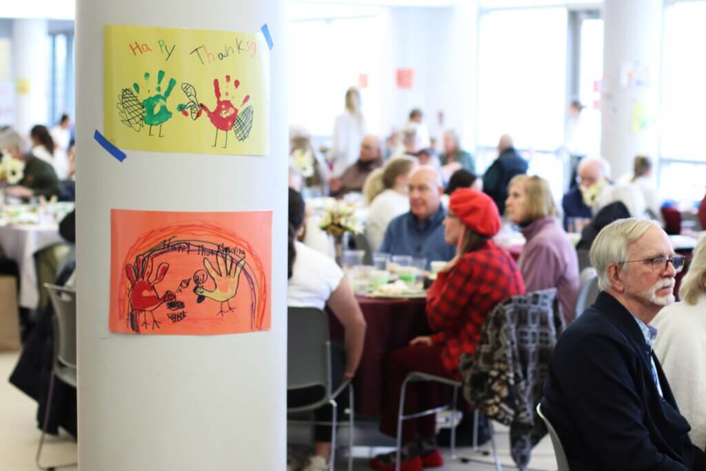 Handprint turkeys enlivened the cafeteria between tables adorned with fall-themed decor. Photo: Trace Salzbrenner/ The Acton Bridge