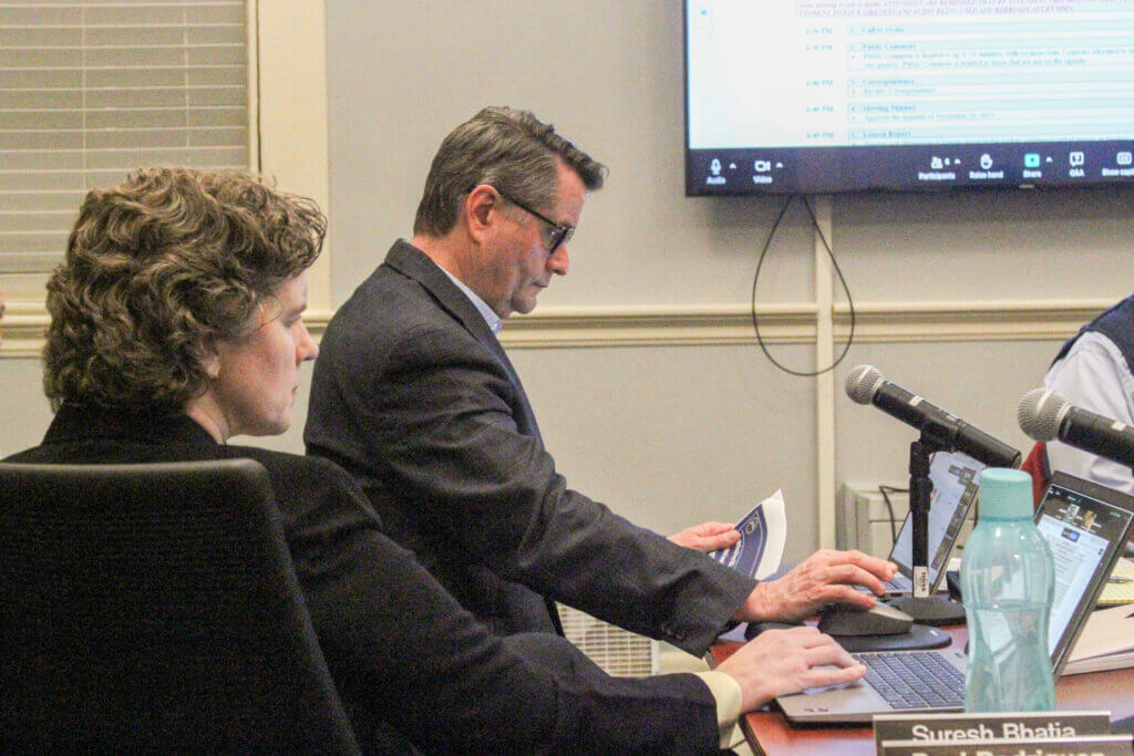 Chief Financial Officer Jennifer Barrett, left, and Assistant CFO Ryan Ferrara, right consult their notes. Photo: Dakota Antelman/The Acton Bridge