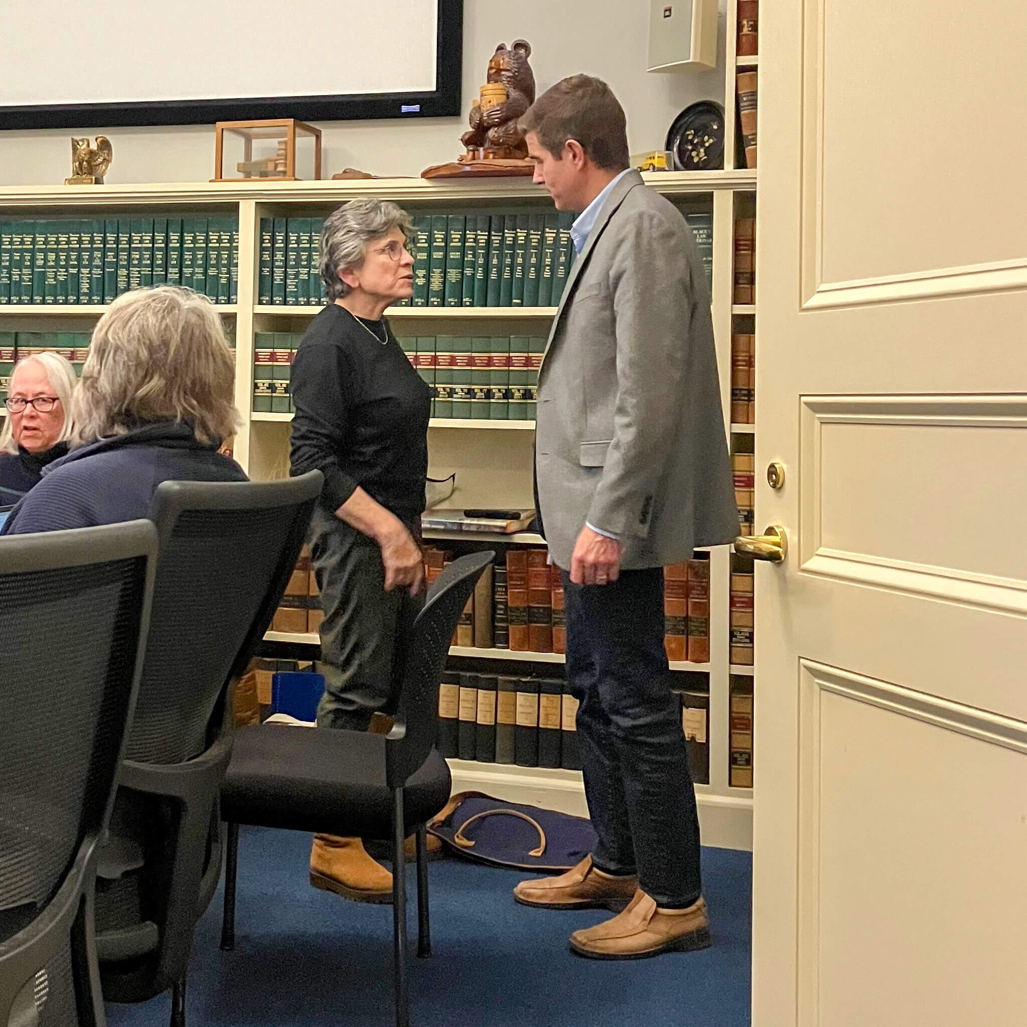 Finance Committee Chair Lois Wasoff holds a brief conversation with panelist Eric Dahlberg amid a disagreement about final budget guidelines for the 2027 fiscal year. Photo: Dakota Antelman/The Acton Bridge