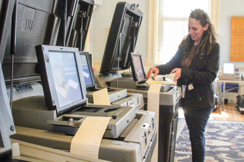 Elections and Census Manager Justine Donovan spent several hours ensuring that all of Acton’s election machines are running properly. Photo: Dakota Antelman/The Acton Bridge