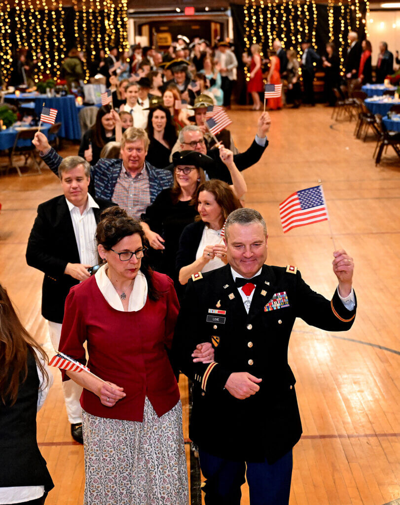 Lt. Col. Geoffrey Love, bottom right, director of historical services at the Massachusetts National Guard Museum at the Acton Armory, leads the Grand March Promenade at the conclusion of the 2025 Patriots Ball at the Acton Armory on Saturday, April 12, 2025. Ken McGagh/The Acton Bridge