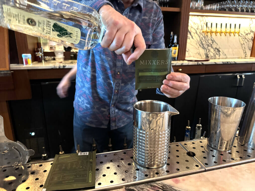 Cannon measures ingredients for a margarita, using Mixxers. Photo by Gabriel Martins