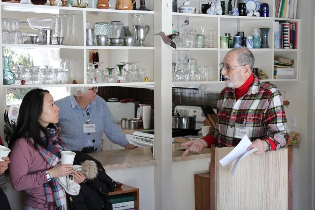 Geoff Tritsch, right, speaks to home tour attendees in his living room. Photo: Dakota Antelman/The Acton Bridge