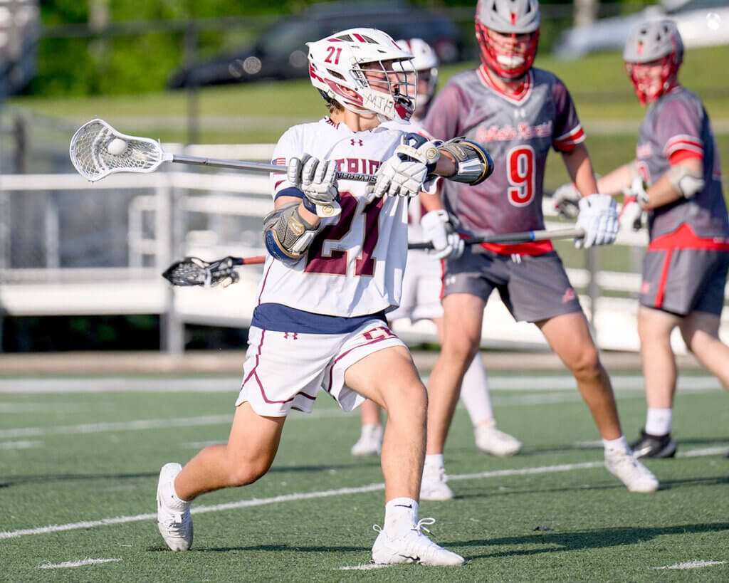Acton-Carlisle’s Lukas Lundberg (No. 21) against Catholic Memorial. Photo by Jon Straggas