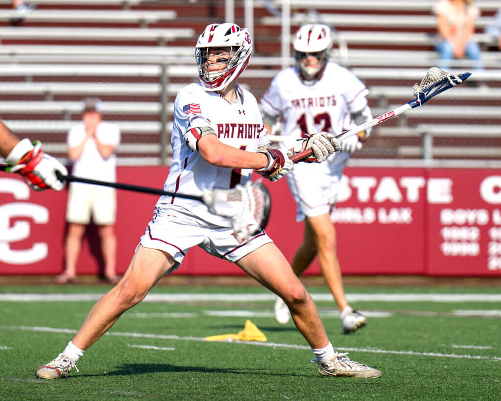 Acton-Carlisle’s defender turned attack Sam Griswold (No. 1) lines up his shot. Photo by Jon Straggas