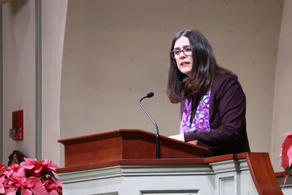 The Rev. Jennifer Johnson of First Parish speaks from the pulpit. Photo: Trace Salzbrenner/The Acton Bridge