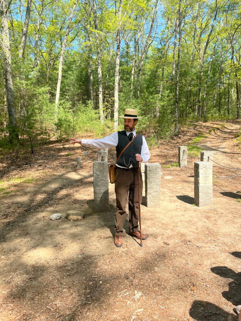 As “Henry,” Brent Ranalli stands at the original site of Thoreau’s cabin. Courtesy photo