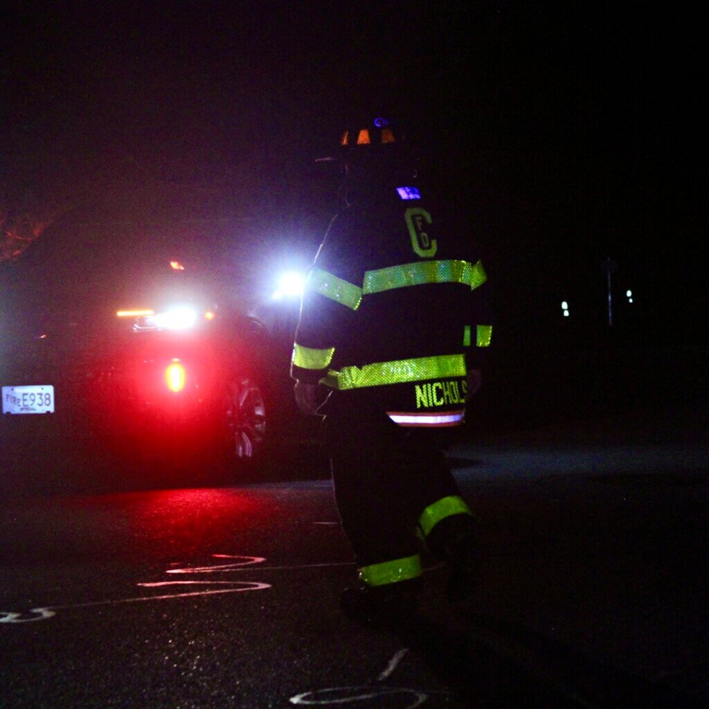 A Acton firefighter outside Thoreau Elementary School on Monday. Photo: Dakota Antelman/The Acton Bridge