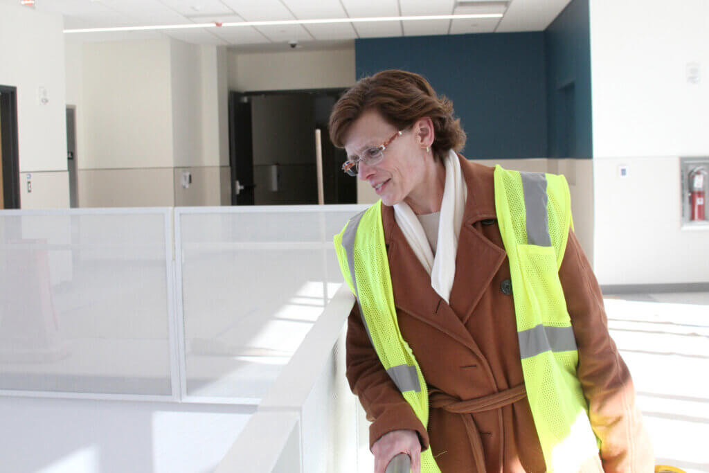 Hunter looks into the school lobby from an elevated walkway.