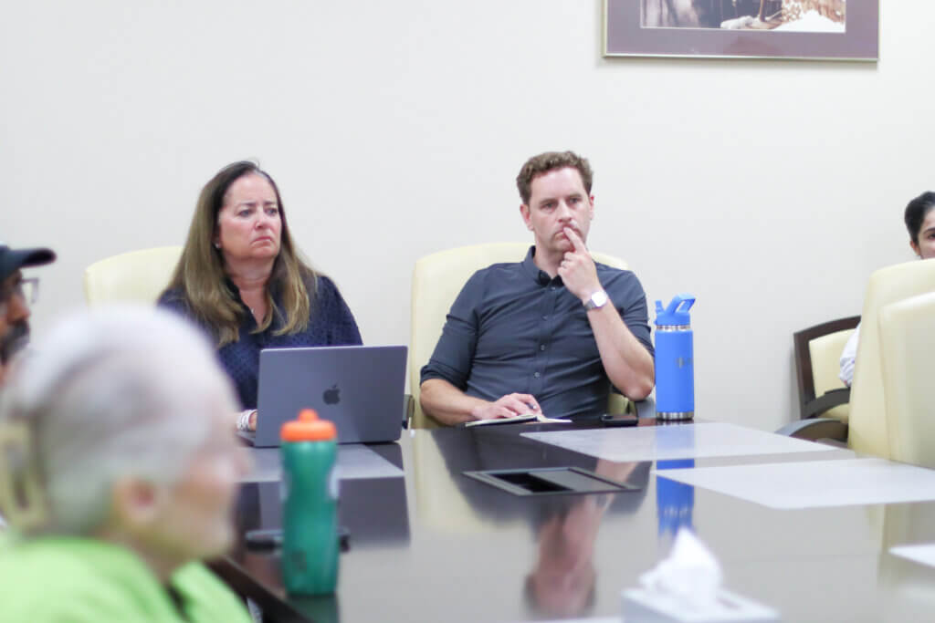 CCHS School Committee chair, Tracey Marano, and K-8 committee chair Andrew Herchek listen to Monday’s Select Board meeting from an overflow room. Photo: Trace Salzbrenner/The Acton Bridge