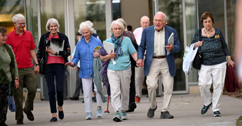 Residents of Newbury Court emerge victorious after Town Meeting voters approve Article 46, a zoning change allowing for the expansion of their senior living complex. Photo: Ken McGagh/The Acton Bridge