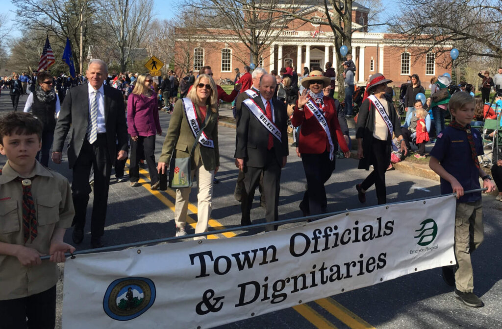 Reiss, in red, walks in the 2016 Patriots Day parade, her first as town moderator. Courtesy photo