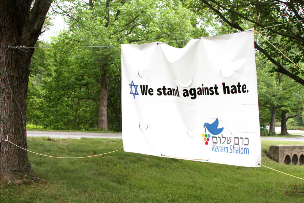 A sign waves outside the Kerem Shalom synagogue. Photo: Dakota Antelman/The Acton Bridge