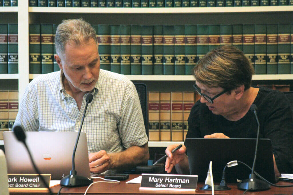 Select Board Chair Mark Howell and board member Mary Hartman confer during an October 6 meeting. Photo: Dakota Antelman/The Acton Bridge