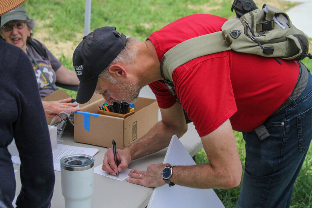 De-ICE Hanscom spokesperson Todd Palmer writes a letter to Gov. Maura Healey calling for webcams to help track ICE flights. Photo: Dakota Antelman/The Acton Bridge